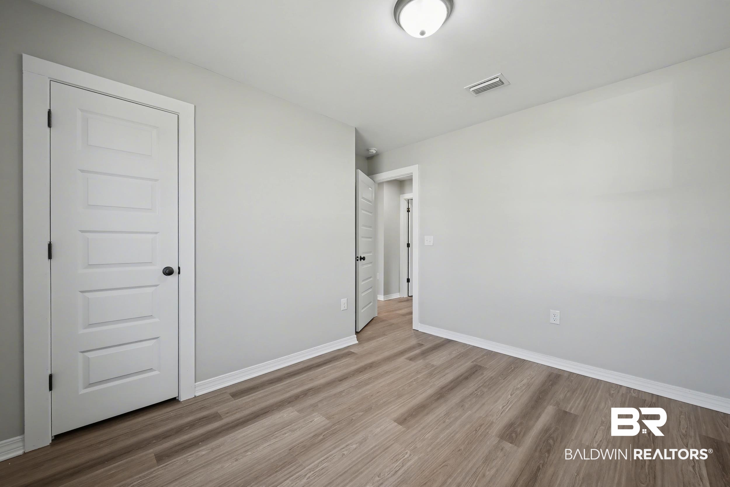 76 Fincher Lane Loxley, AL 36551 - Photo 23 of 33 Unfurnished bedroom with light wood finished floors