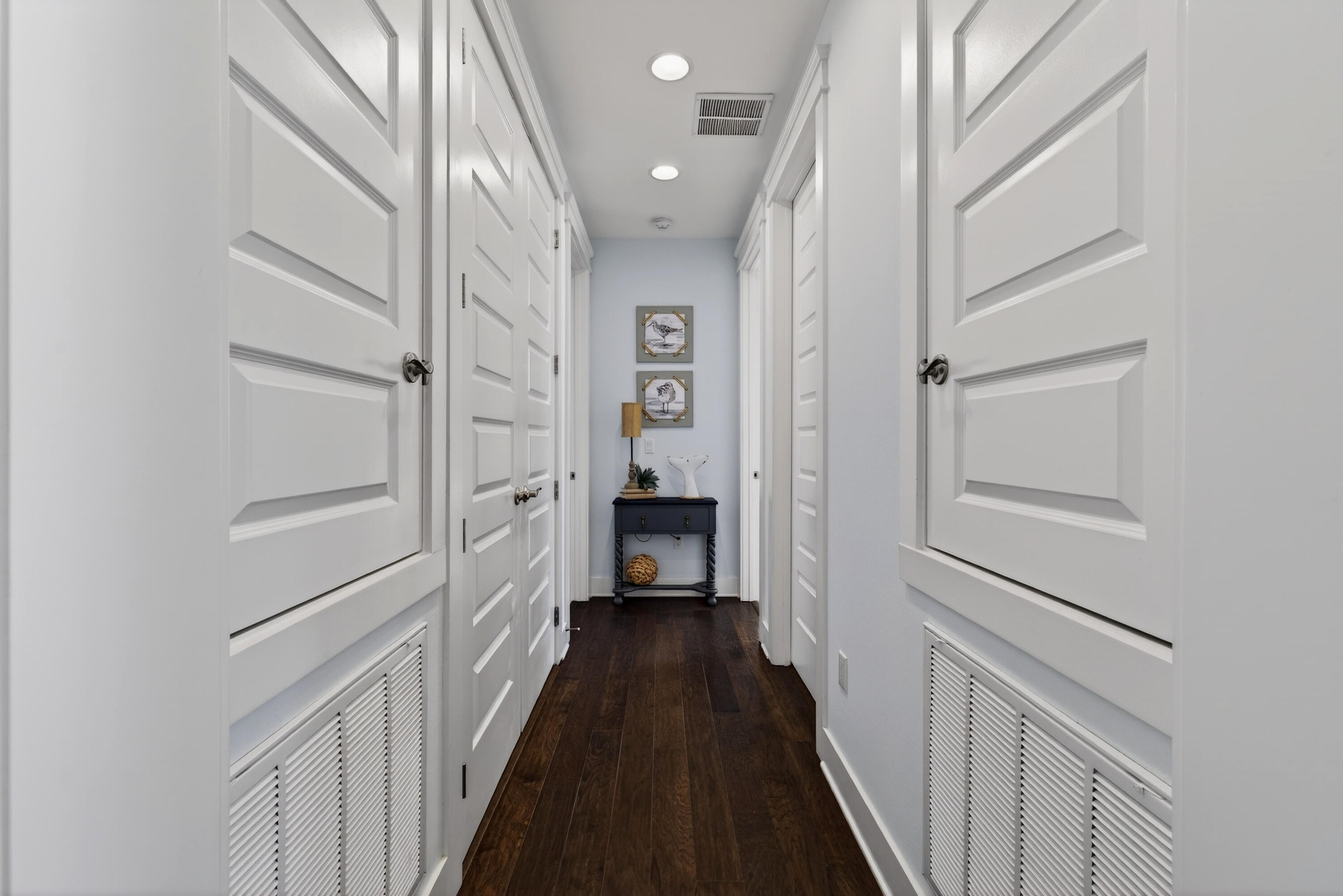 410 Gulfview Circle Santa Rosa Beach, FL 32459 - Photo 40 of 76 a view of a hallway with wooden floor and staircase