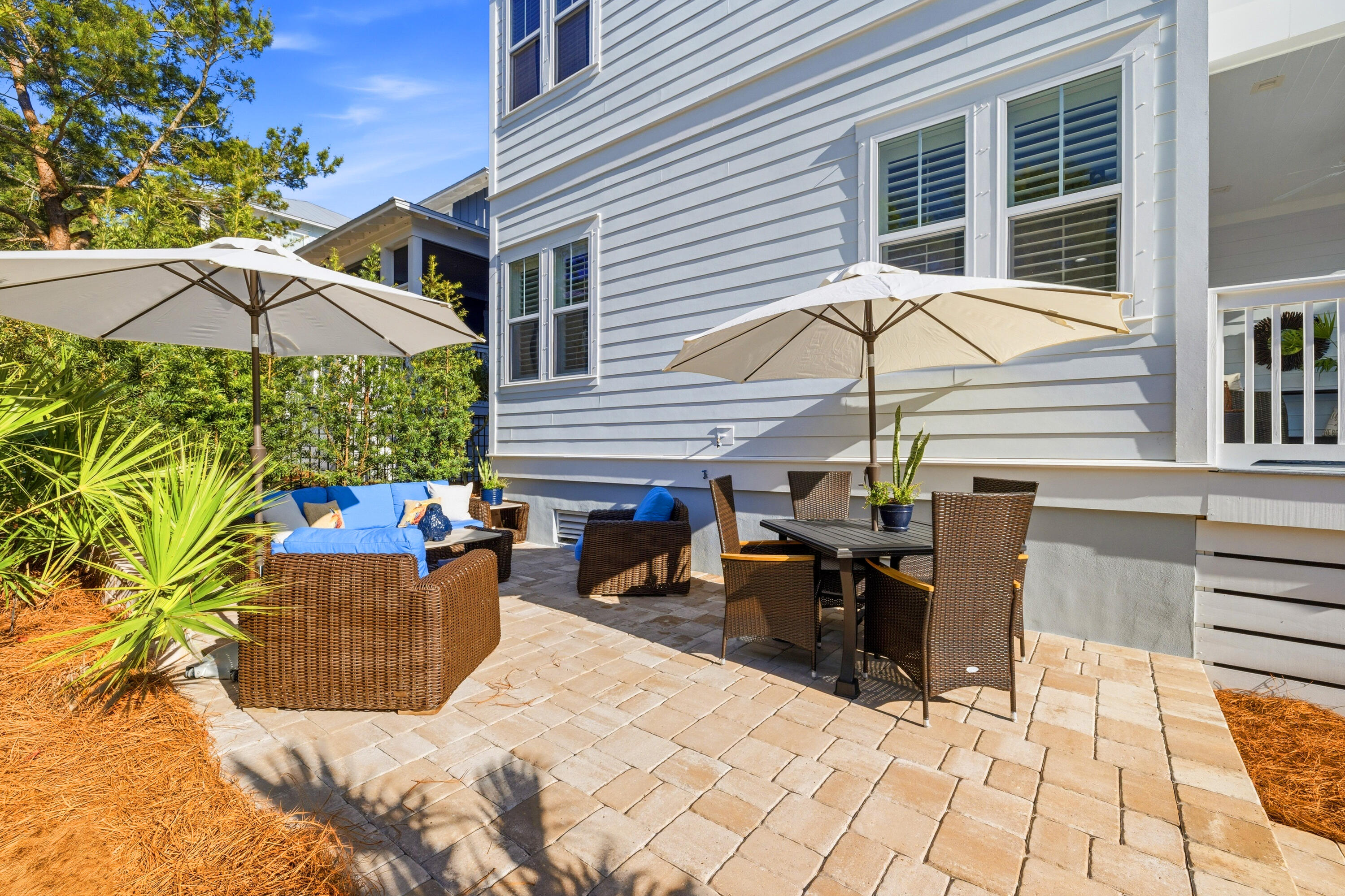 410 Gulfview Circle Santa Rosa Beach, FL 32459 - Photo 53 of 76 a view of a patio with a table and chairs under an umbrella