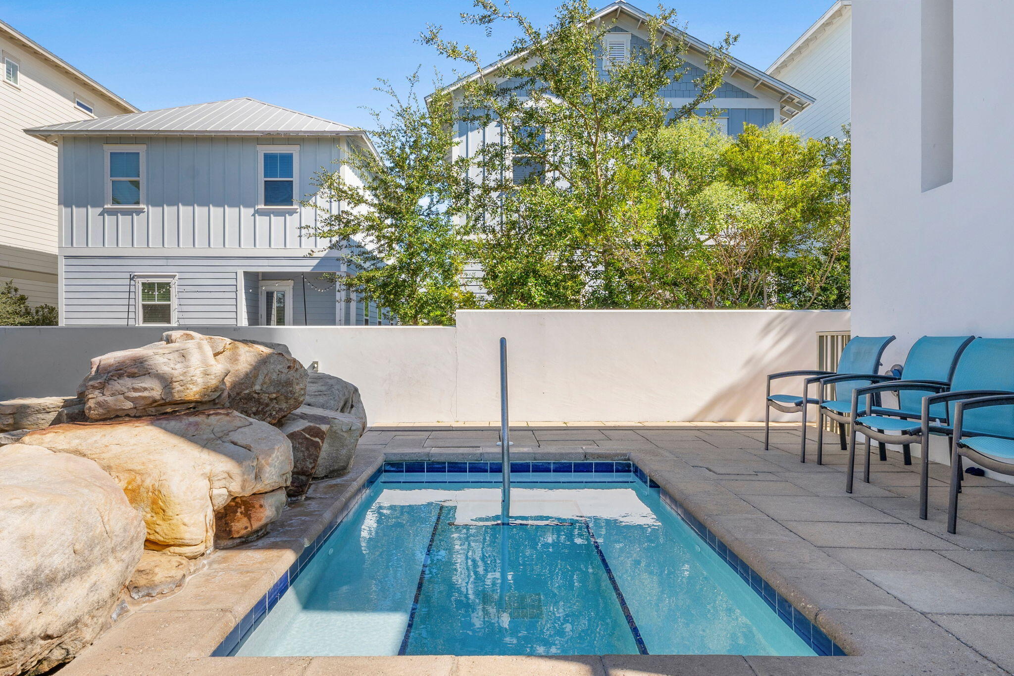 410 Gulfview Circle Santa Rosa Beach, FL 32459 - Photo 72 of 76 a view of a patio with table and chairs with wooden floor and fence