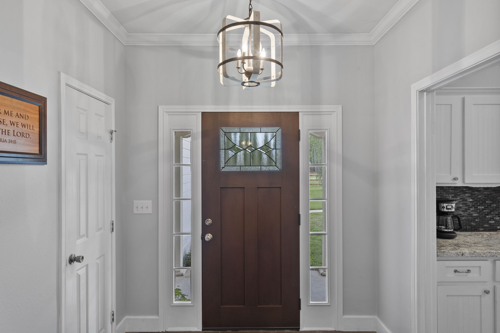 23200 Baneberry Road Magnolia, TX 77355 - Photo 5 of 39 a front view of a house with wooden floor windows and cabinet