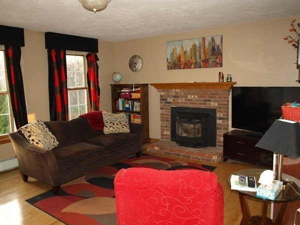 9 A Vinton Road Charlton, MA 01507 - Photo 4 of 23 a living room with furniture and a fireplace