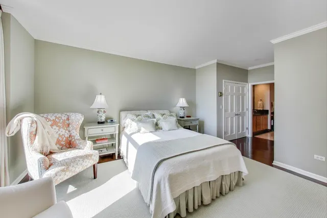 a spacious bedroom with a bed and a couch