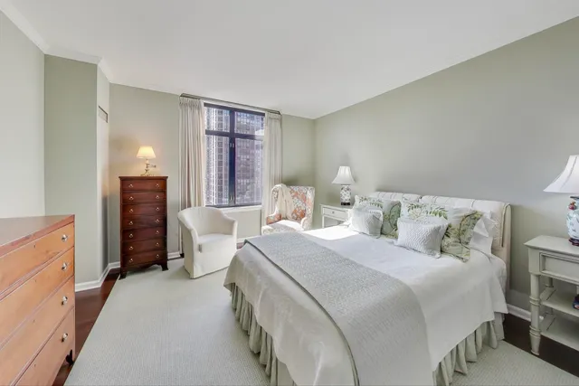 a bed room with a bed and a window