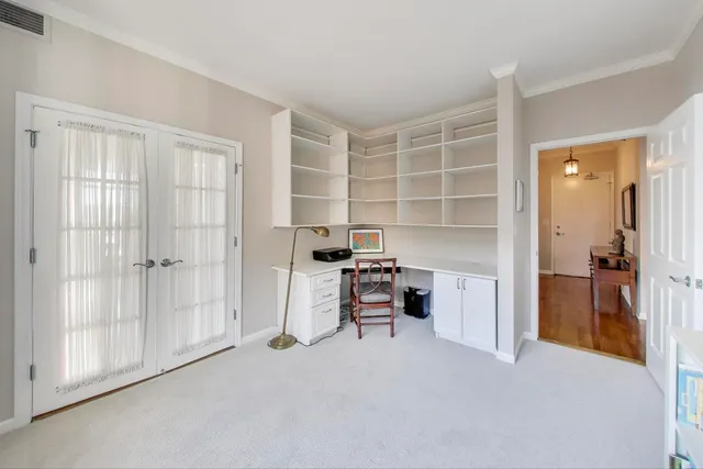 a view of a bedroom with cabinet and a bathroom