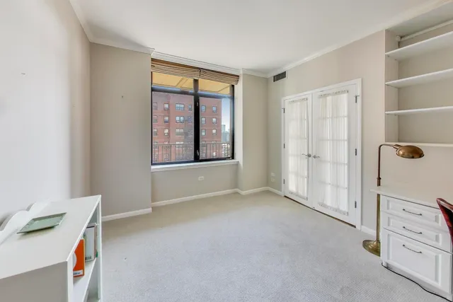 a view of an empty room with a window