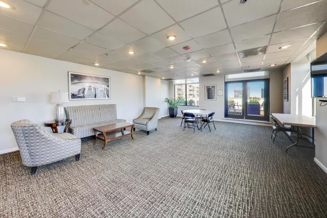 a kitchen with stainless steel appliances a refrigerator sink and cabinets