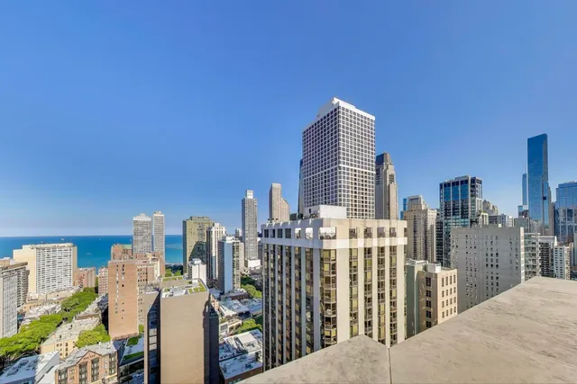 a kitchen with a table chairs and a sink