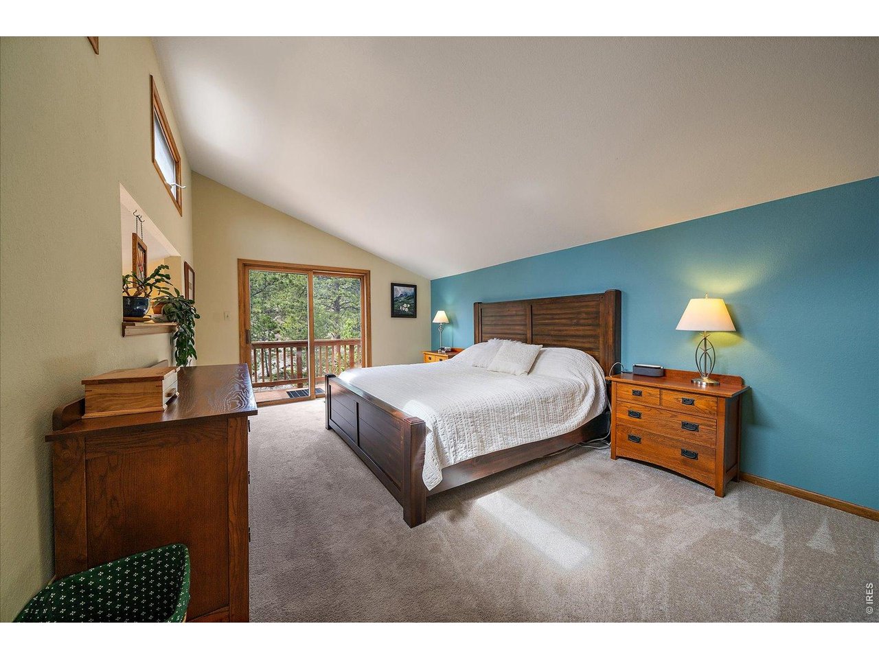 902 Rock Lake Road Ward, CO 80481 - Photo 11 of 32 Occupying an entire floor, this primary sanctuary features an ensuite 3/4 bath and a private balcony overlooking the National Forest. Your daily escape is just up the stairs.