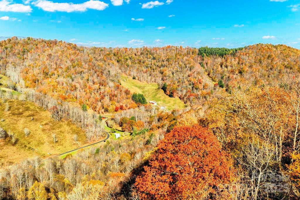 Tbd East Little Horse Creek Road Lansing, NC 28643 - Photo 11 of 23 a view of a building with mountains in the background