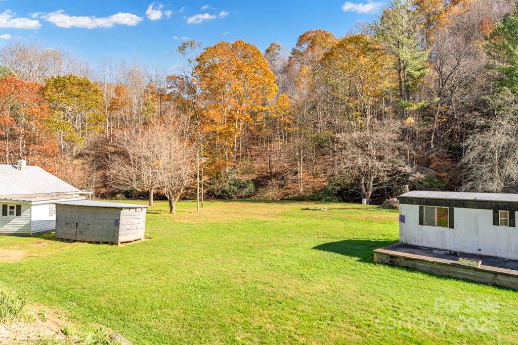 Tbd East Little Horse Creek Road Lansing, NC 28643 - Photo 23 of 23 a view of a house with a yard and a large tree