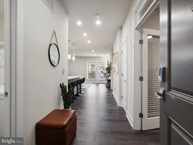 a hall way with furniture and a entryway