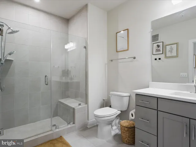 a bathroom with a toilet a sink and shower
