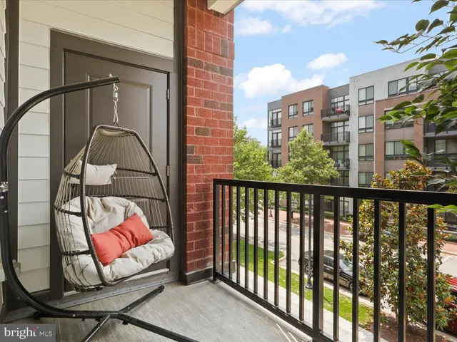 a view of a balcony with furniture
