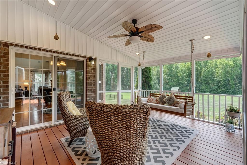 8933 Grove Park Drive Oak Ridge, NC 27310 - Photo 13 of 36 SCREENED PORCH