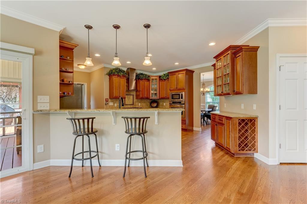 8933 Grove Park Drive Oak Ridge, NC 27310 - Photo 14 of 36 VIEW OF KITCHEN FROM DINETTE