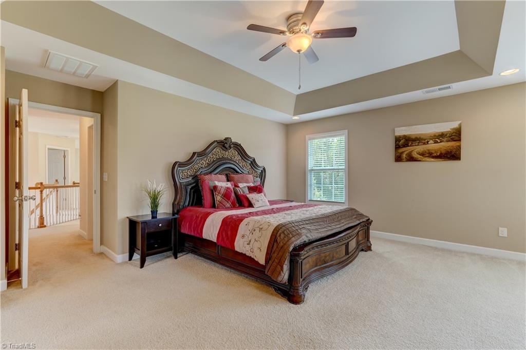 8933 Grove Park Drive Oak Ridge, NC 27310 - Photo 19 of 36 PRIMARY BEDROOM