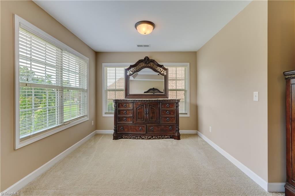 8933 Grove Park Drive Oak Ridge, NC 27310 - Photo 21 of 36 PRIMARY SITTING AREA