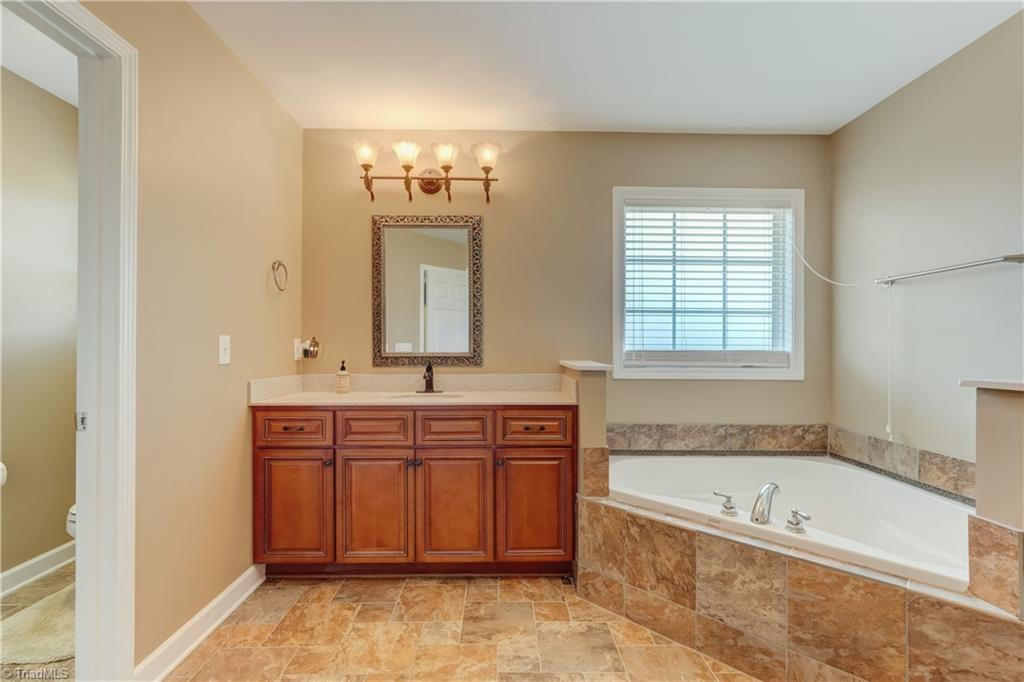 8933 Grove Park Drive Oak Ridge, NC 27310 - Photo 24 of 36 PRIMARY BATH VIEW FROM ENTRANCE