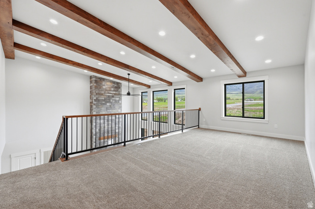 2970 North Mahogany Vly Road Logan, UT 84341 - Photo 18 of 39 Spare room with carpet, beamed ceiling, recessed lighting, and ceiling fan