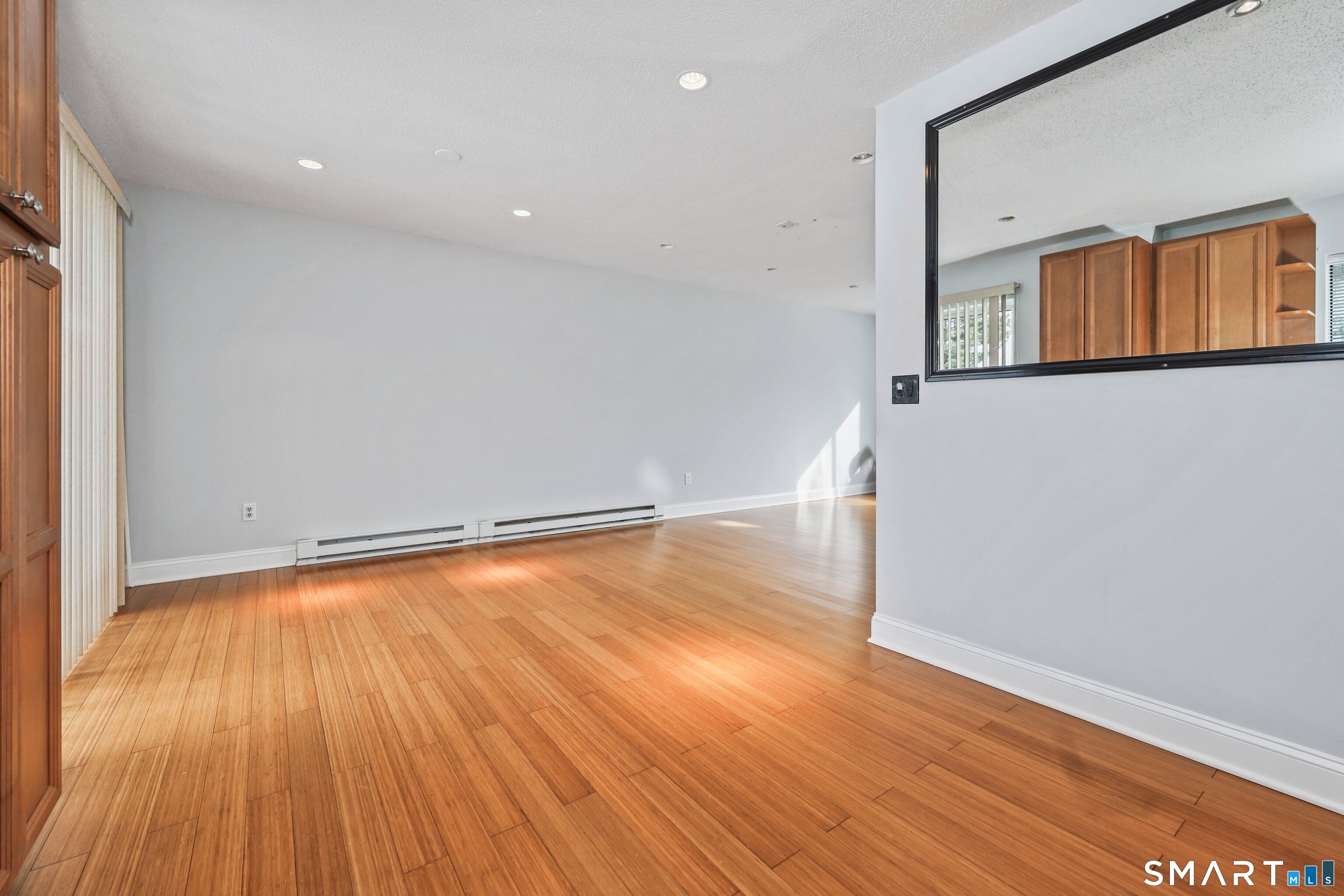 925 Oronoke Road, Unit 11D Waterbury, CT 06708 - Photo 13 of 21 wooden floor in an empty room with a window