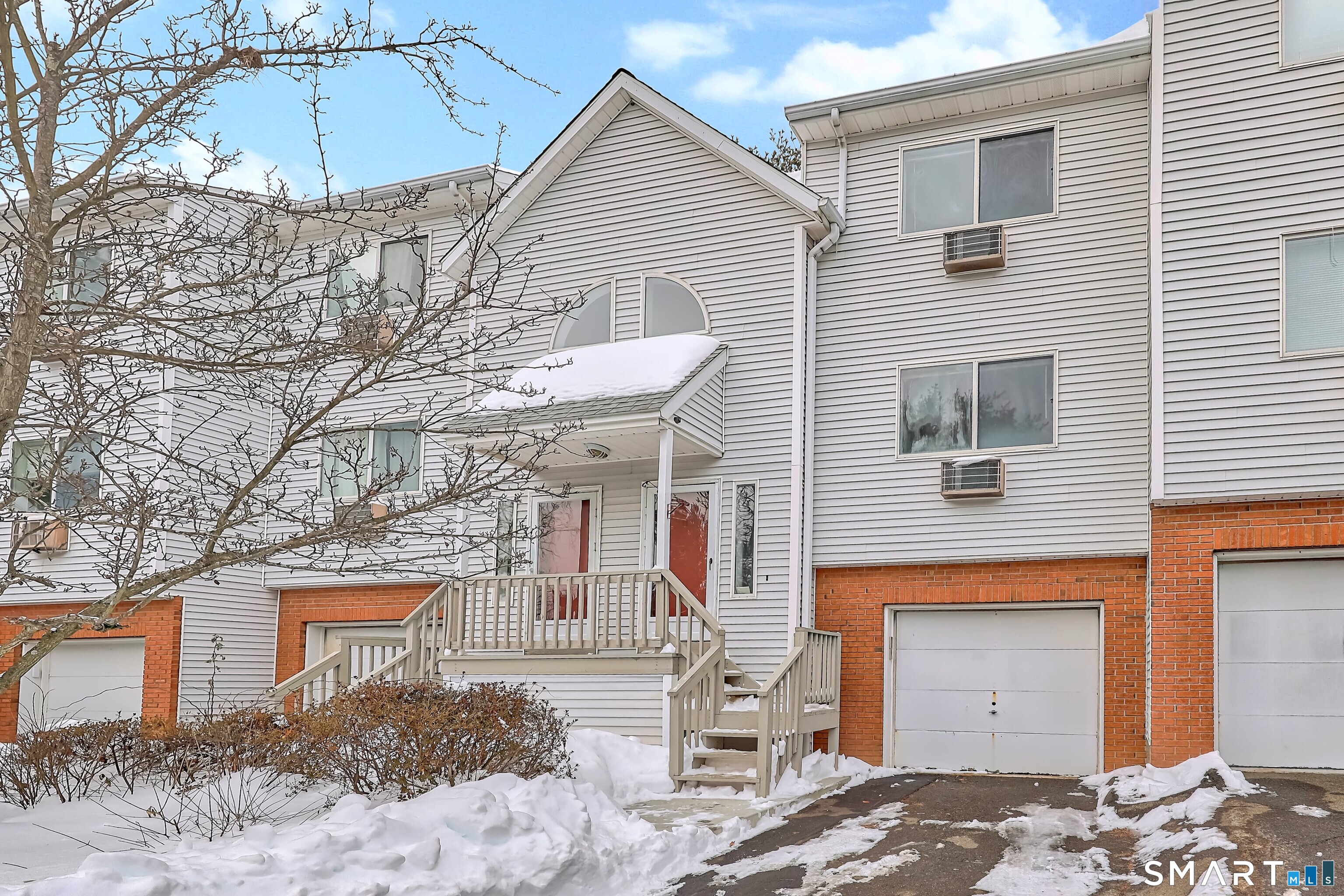 925 Oronoke Road, Unit 11D Waterbury, CT 06708 - Photo 7 of 21 a front view of a house with a garage