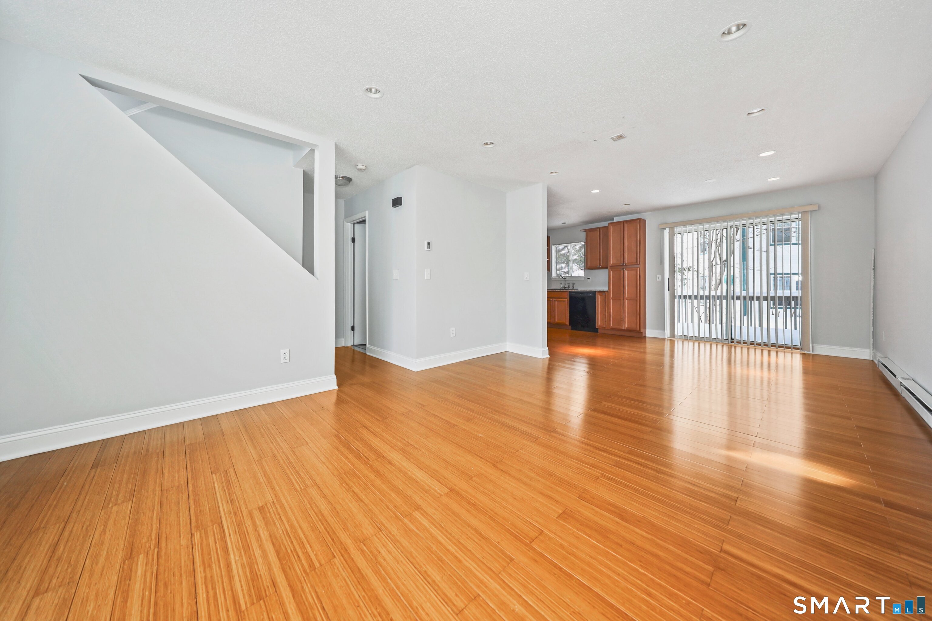 925 Oronoke Road, Unit 11D Waterbury, CT 06708 - Photo 9 of 21 a view of empty room with wooden floor and window