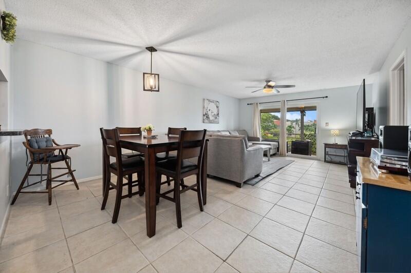 2700 Fiore Way, Unit 211 Delray Beach, FL 33445 - Photo 3 of 15 04_2700FioreWay_93_LivingRoomDiningRoom_