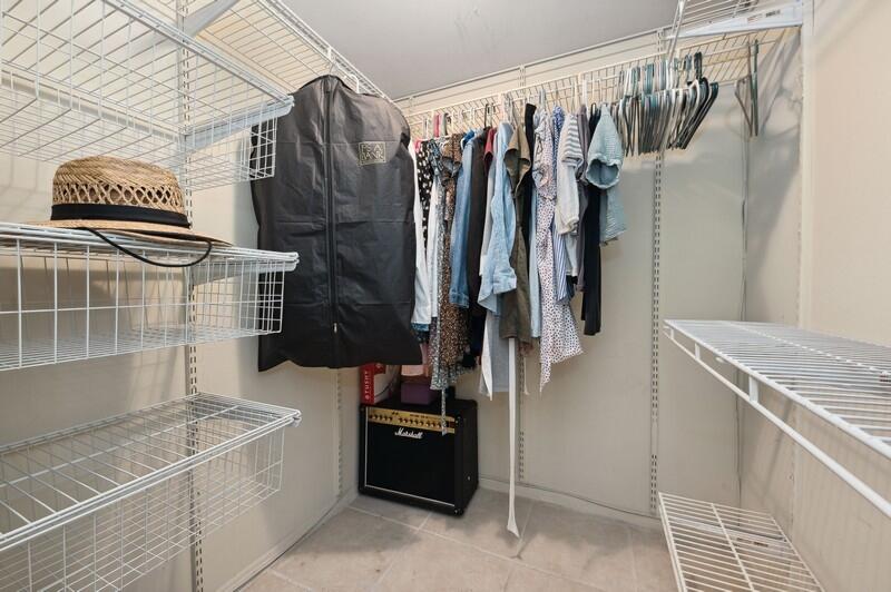 2700 Fiore Way, Unit 211 Delray Beach, FL 33445 - Photo 9 of 15 08_2700FioreWay_45_PrimaryBedroomCloset_