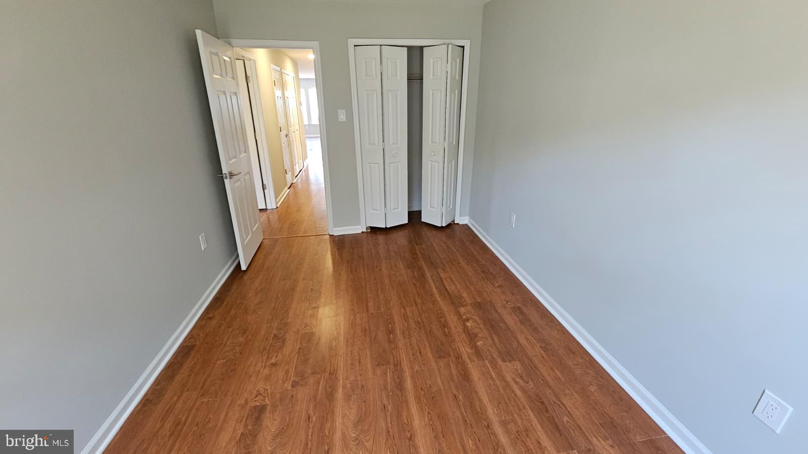 9228-38 Blue Grass Road, Unit 27 Philadelphia, PA 19114 - Photo 13 of 15 a view of a room with wooden floor and window
