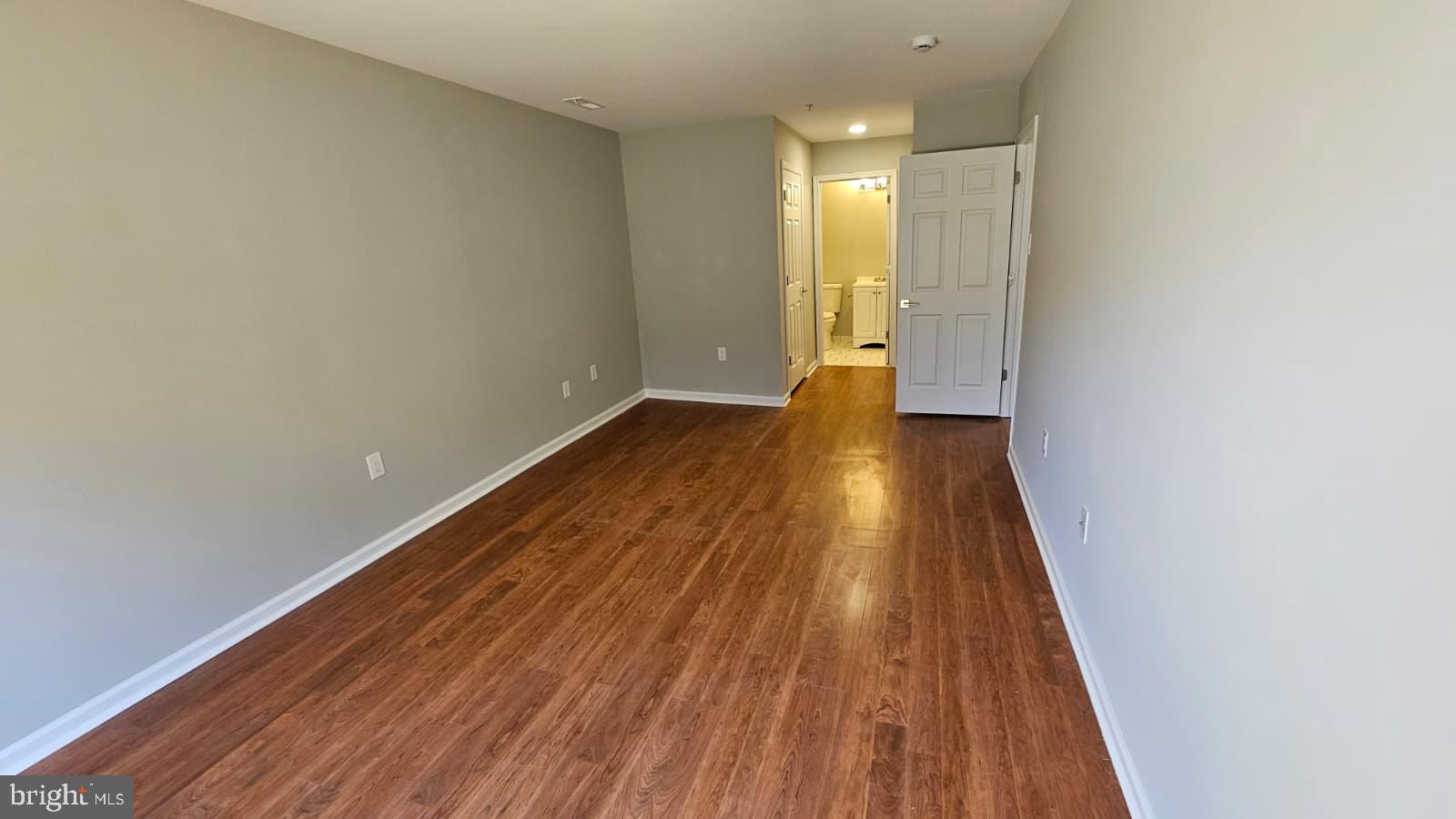 9228-38 Blue Grass Road, Unit 27 Philadelphia, PA 19114 - Photo 15 of 15 a view of wooden floor in an empty room