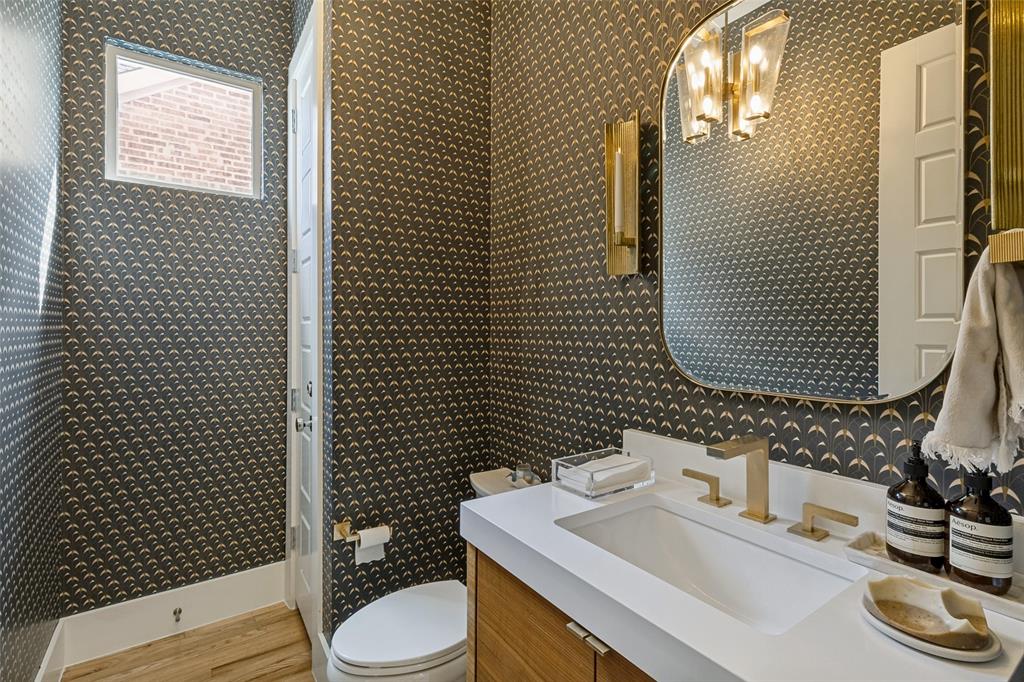 7533 Garonne Street Dallas, TX 75231 - Photo 4 of 32 a bathroom with a sink toilet and shower