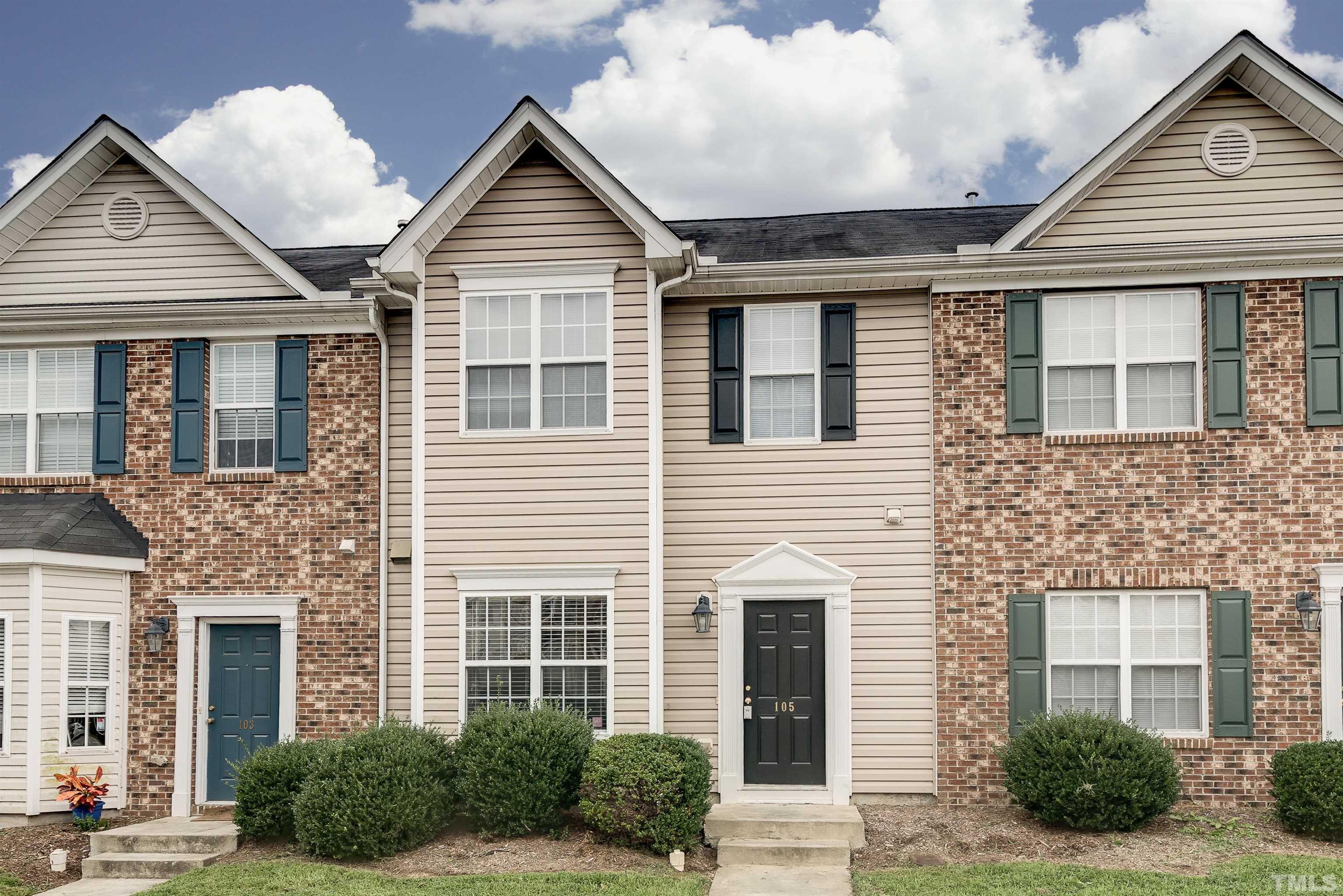 105 Graystar Road Apex, NC 27502 - Photo 1 of 35 a front view of a house with a yard and garage