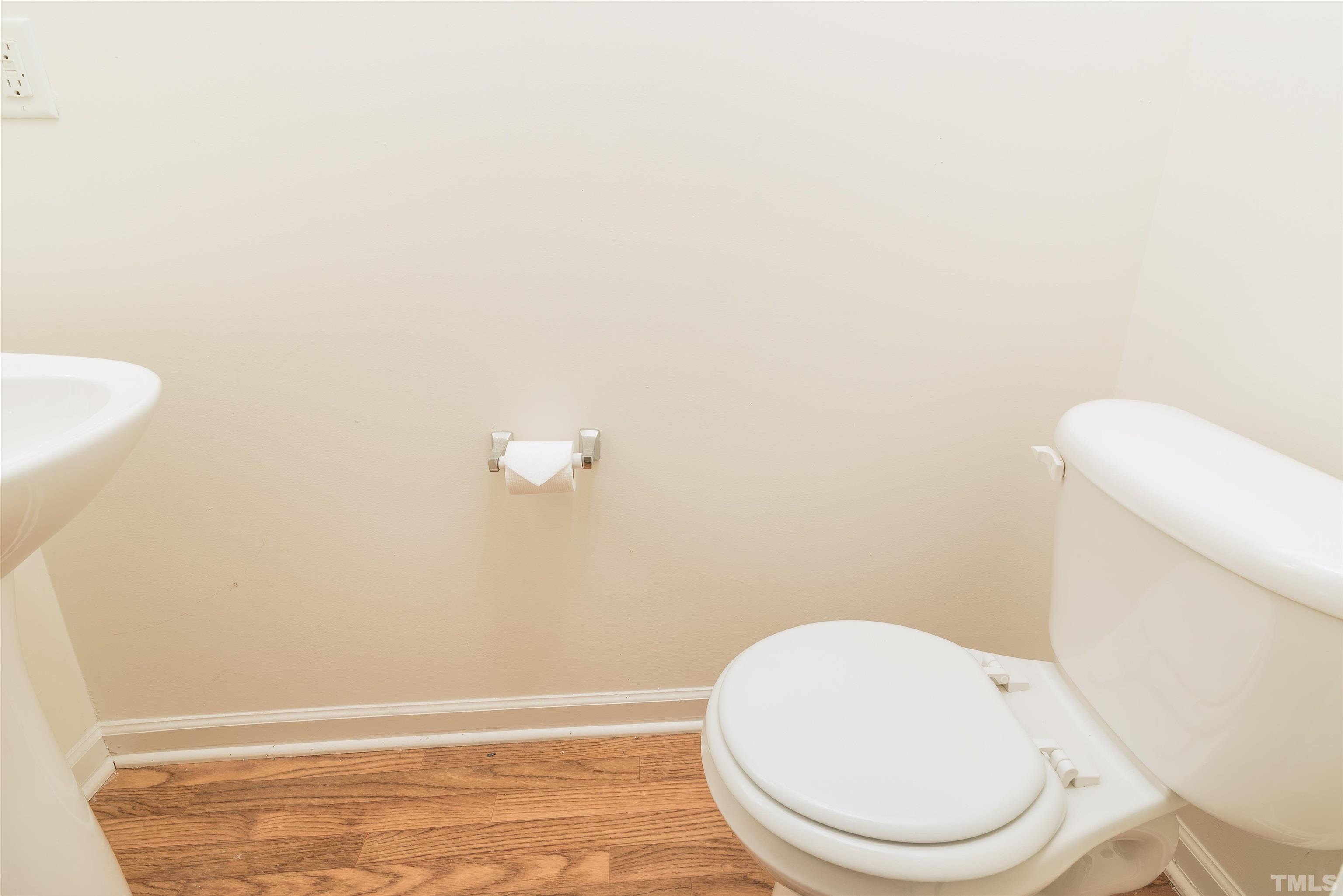 105 Graystar Road Apex, NC 27502 - Photo 16 of 35 a white toilet sitting next to a white sink