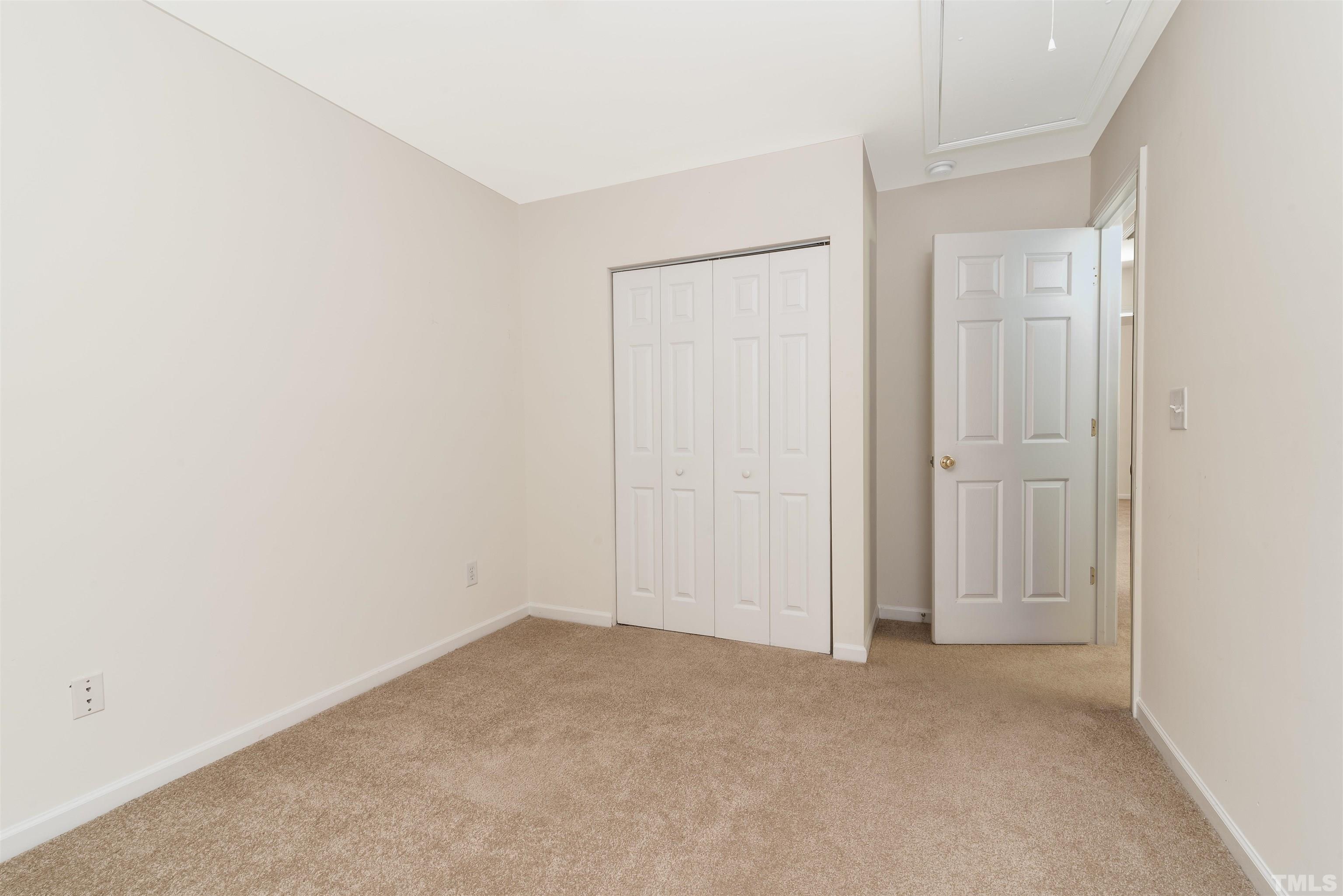 105 Graystar Road Apex, NC 27502 - Photo 17 of 35 an empty room with closet area
