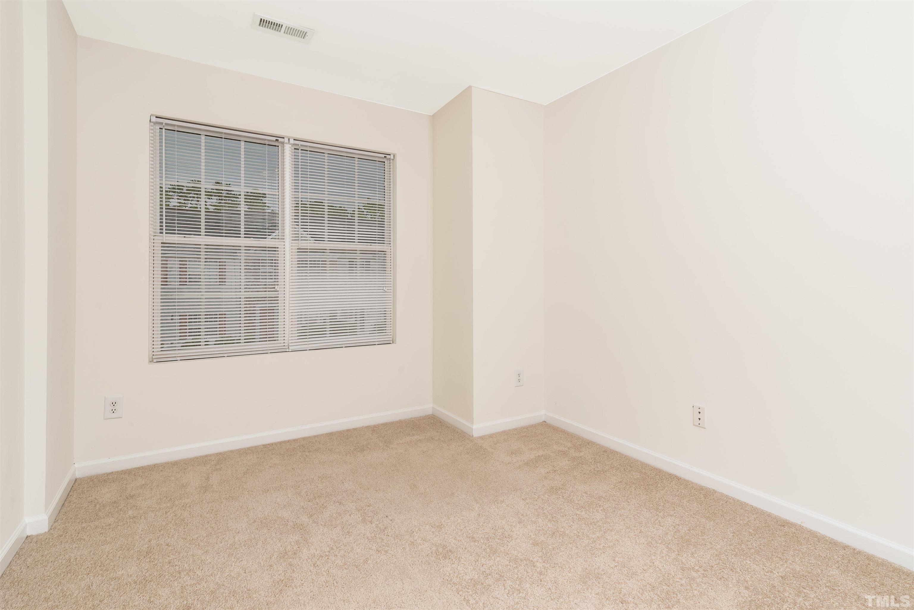 105 Graystar Road Apex, NC 27502 - Photo 20 of 35 an empty room with a window