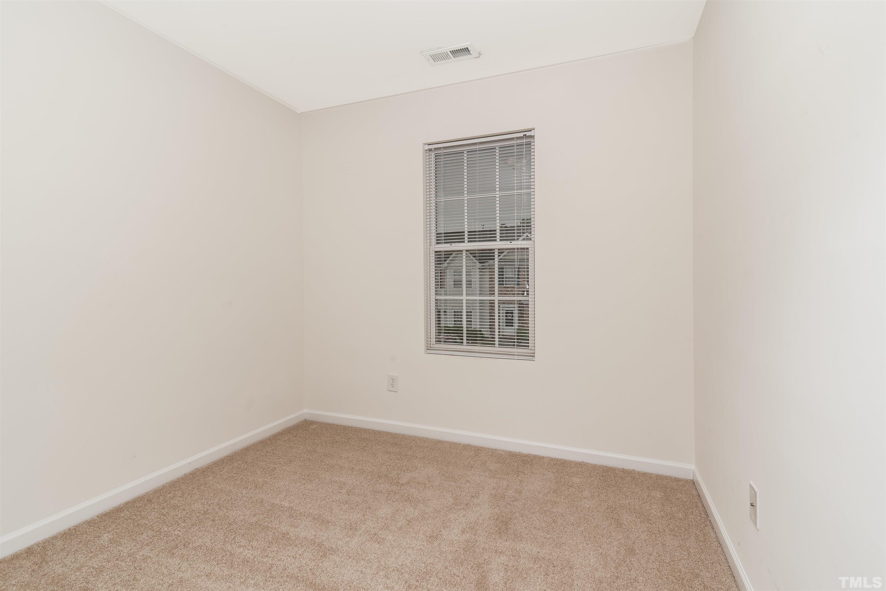 105 Graystar Road Apex, NC 27502 - Photo 22 of 35 an empty room with a window