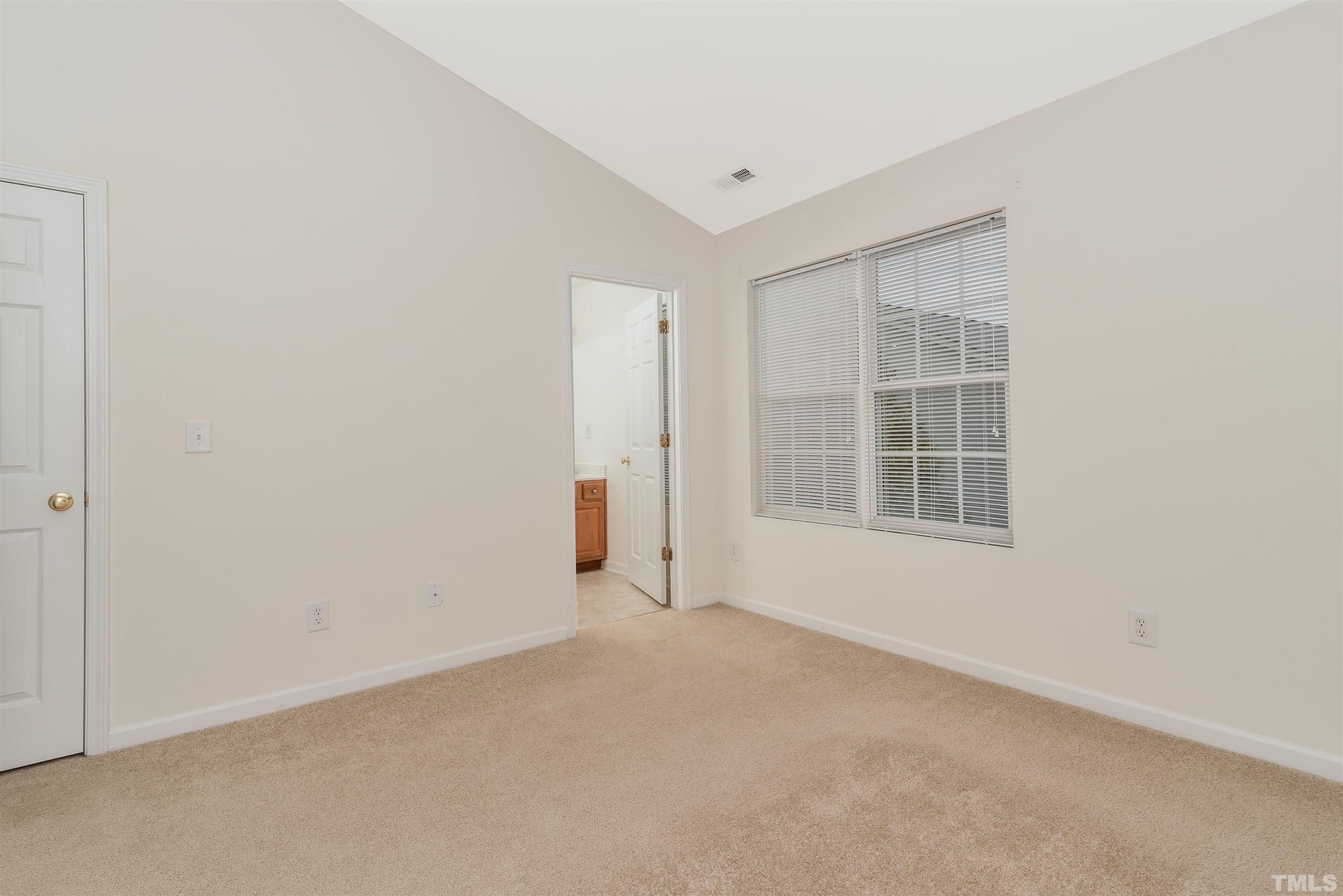 105 Graystar Road Apex, NC 27502 - Photo 25 of 35 an empty room with windows