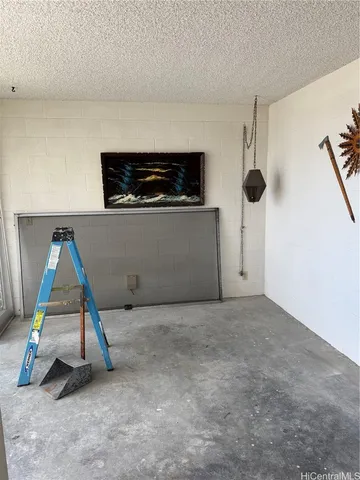 a living room with a flat screen tv and a table
