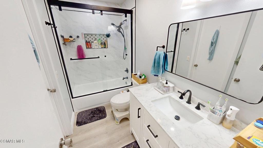 3075 Kelp Lane Oxnard, CA 93035 - Photo 12 of 24 a bathroom with a sink and mirror with window