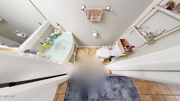 a view of living room with furniture and a wooden floor