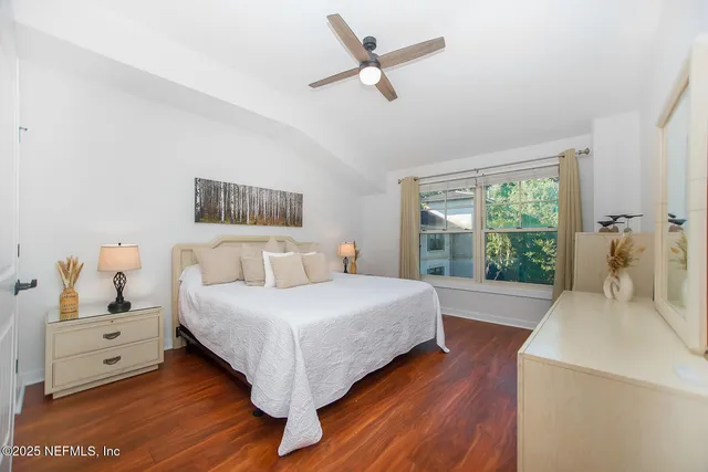 a room with a bed and a window