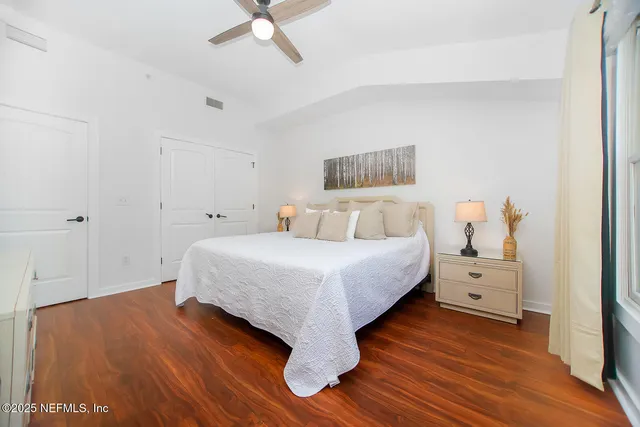 a bedroom with a bed and a dresser