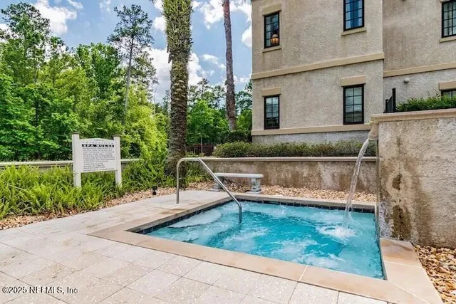a view of a back yard with a bench