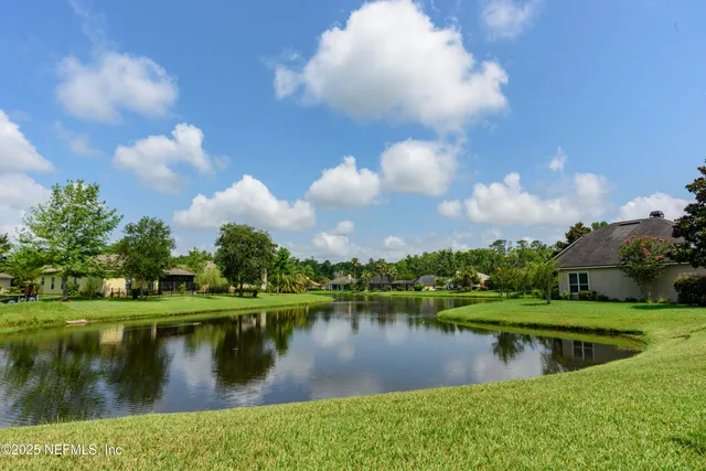 a view of a lake with a yard