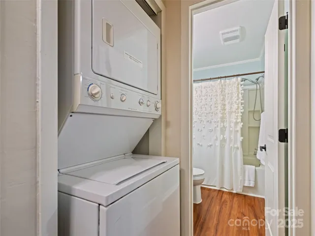 a view of a balcony with chairs and wooden floor