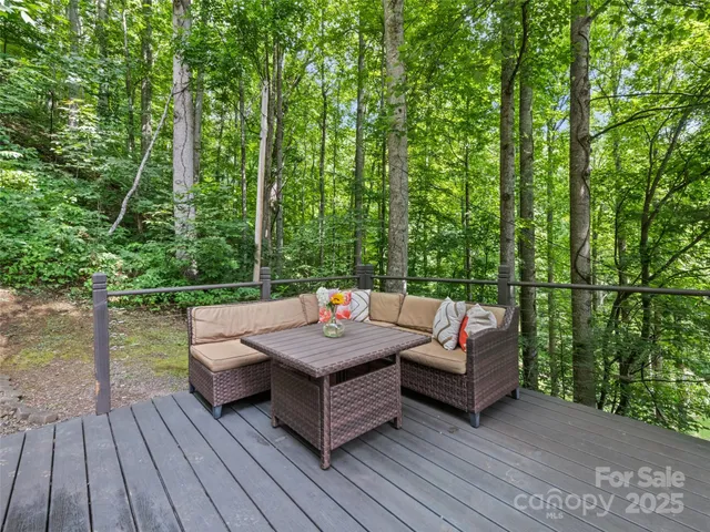 a house with lots of trees in the background