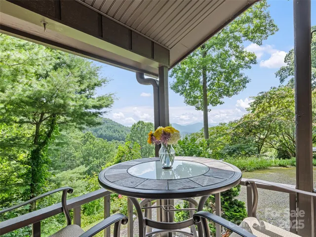 a front view of a house with outdoor seating