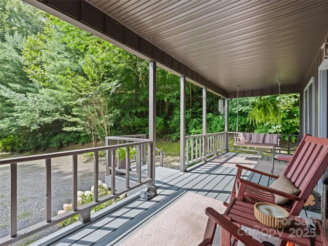 a view of a green field with lots of bushes