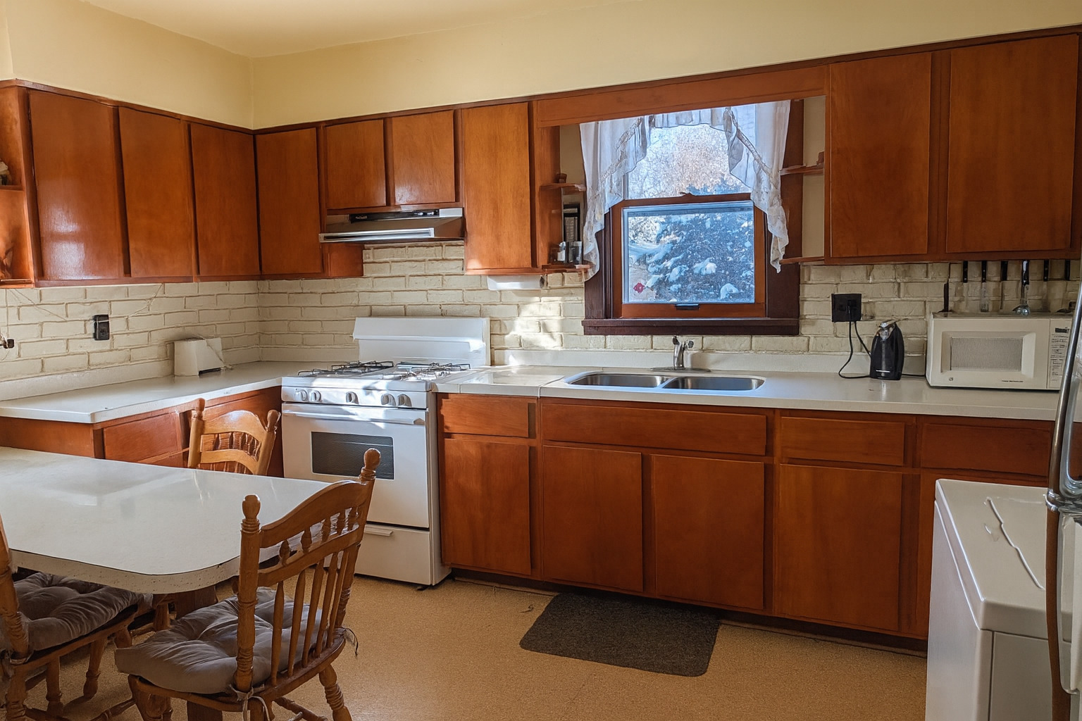 321 Eureka Street Genoa, IL 60135 - Photo 5 of 13 a kitchen with stainless steel appliances granite countertop a sink stove and cabinets